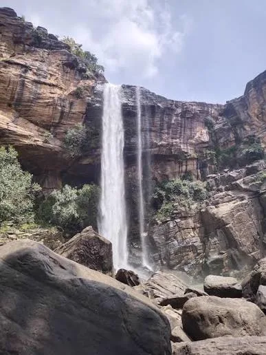 Vindhyan sandstone cliffs and seasonal waterfall in the Ratapani Tiger Reserve landscape